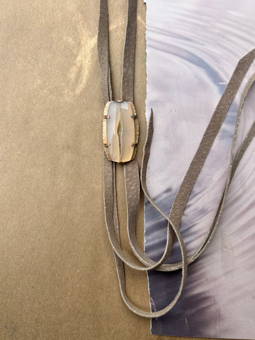white agate with hand-cut suede