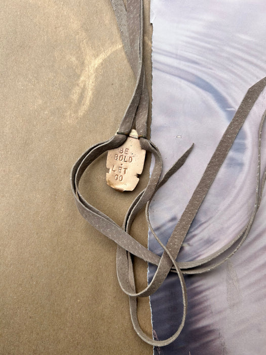 white agate with hand-cut suede
