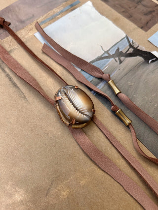 Cowrie shell bolo tie
