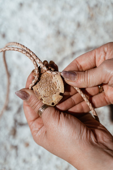 Petrified wood bolo tie