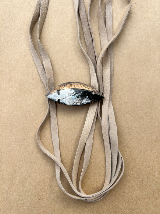 Black and tan petrified wood suede bolo tie