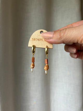 Terracotta, pearl, and orange shell Huggie Hoops